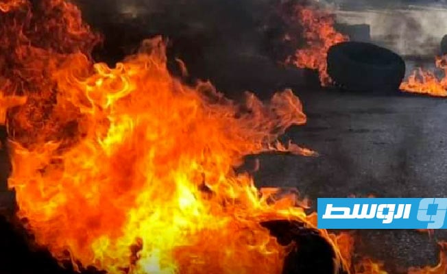 Demonstrators burn tires to protest poor public services in Zintan