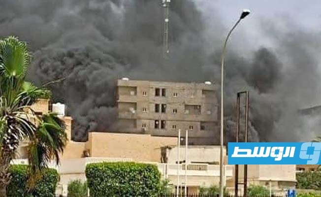 Fire fighters extinguish blaze at food commodities warehouse in Sirte