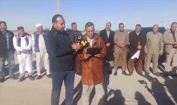 Residents gather to protest delays in the maintenance of the Ajdabiya-Jalo road