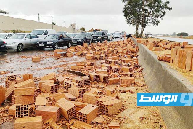 Truck loaded with clay bricks skids off Tripoli's Airport Road