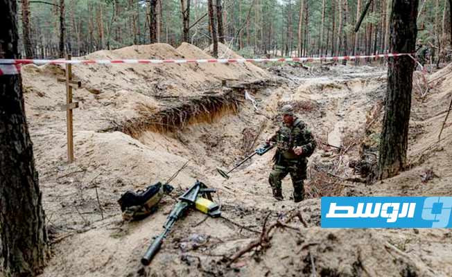 مئات القبور في غابة قريبة من إيزيوم المستعادة من الروس