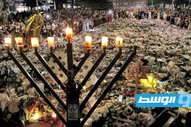 بالشموع والأعلام.. الأستراليون يحيون ذكرى 15 قتيلا في هجوم سيدني