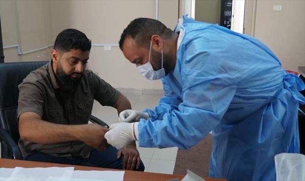 أخذ عينات من أهالي المفقودين تمهيدا لمطابقتها مع جثث مقابر ترهونة